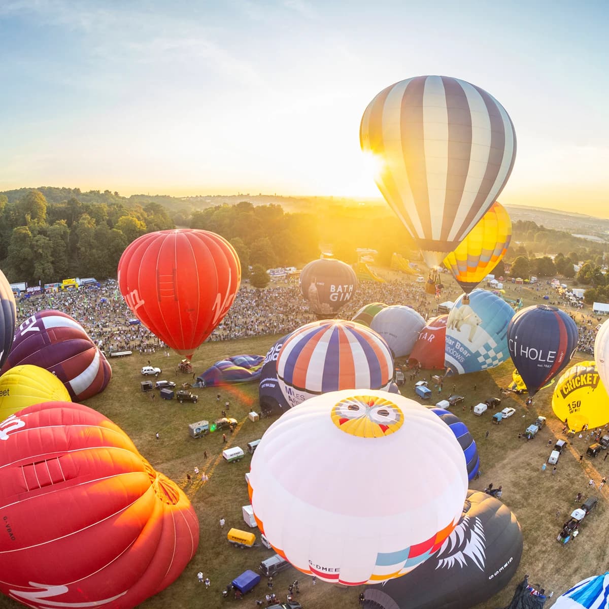 Hot air balloons on a field 