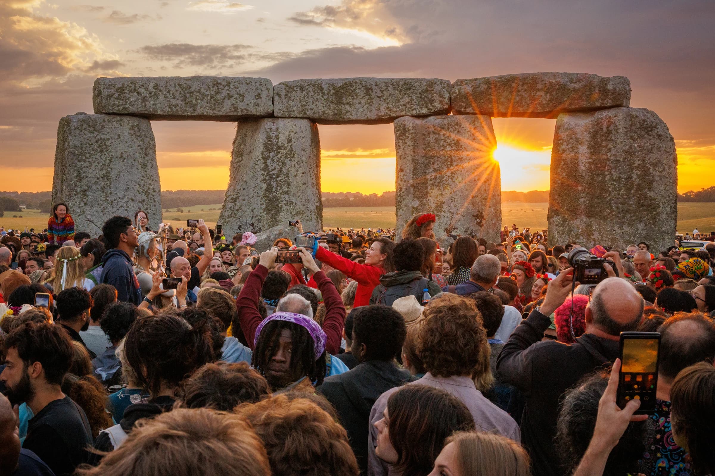 People celebrating at Stonehenge
