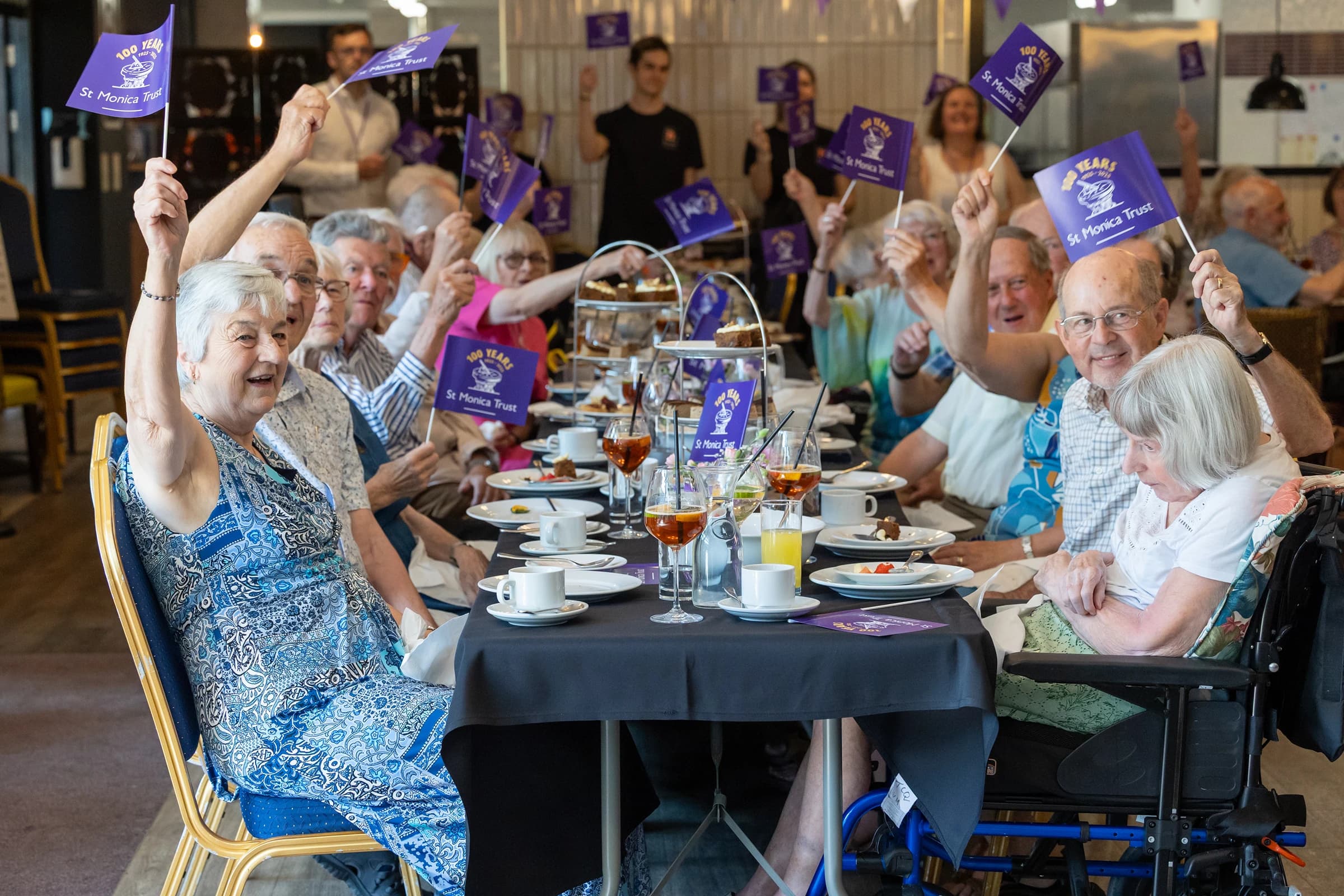 Older people celebrating at a table